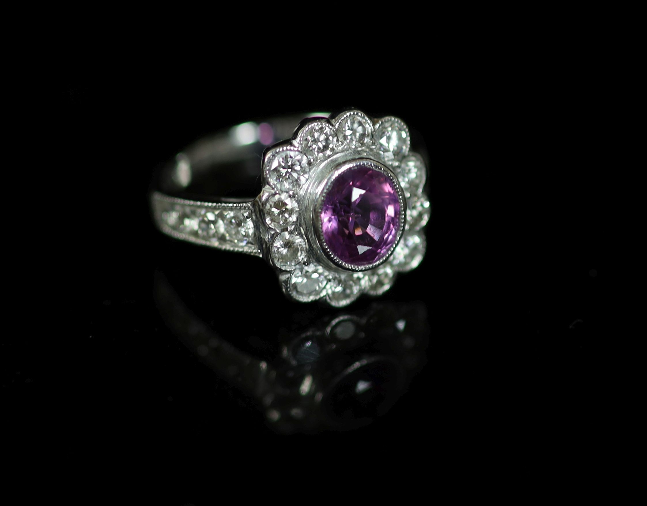 A modern 18ct white gold, pink sapphire and diamond cluster ring